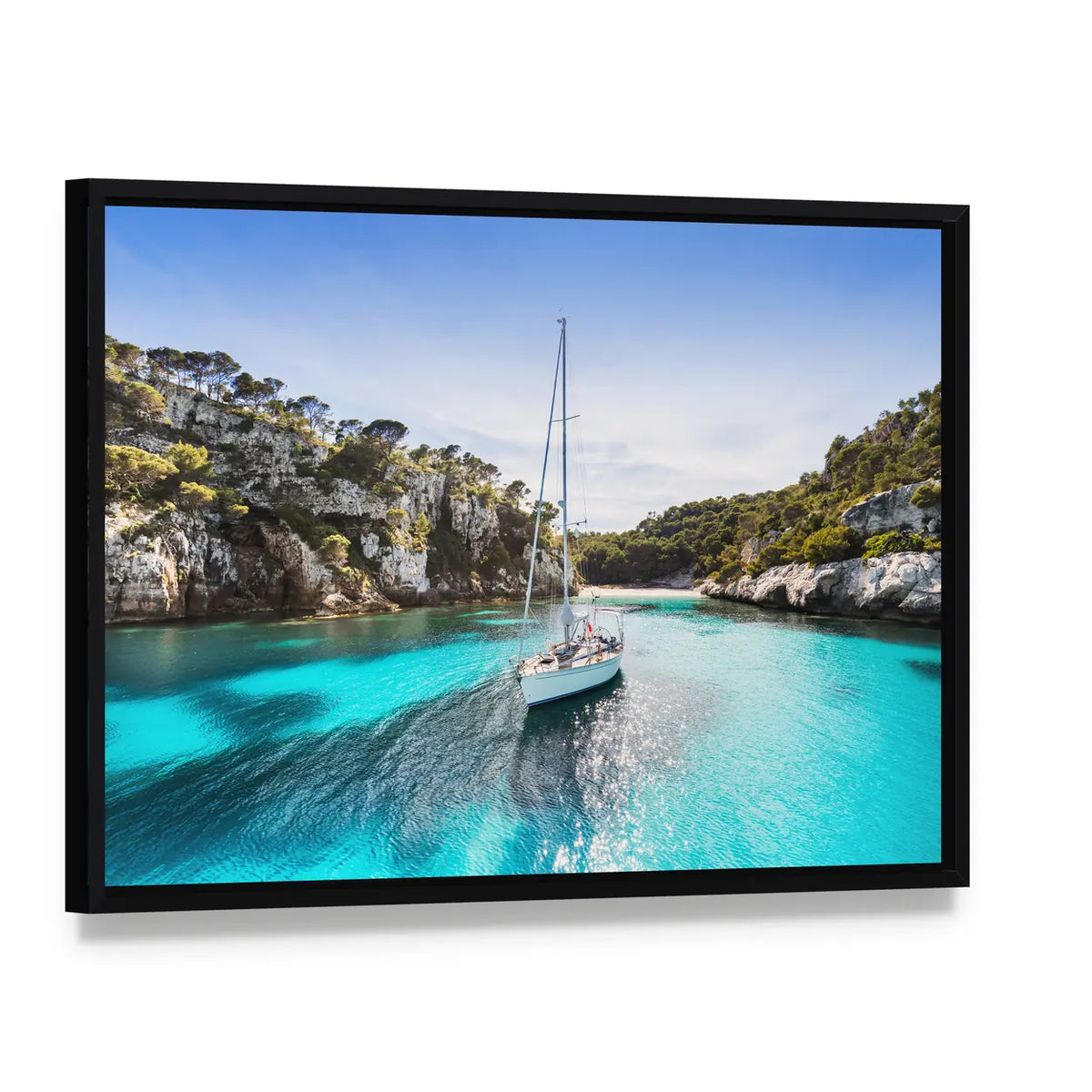 Anchored Sailboat in Turquoise Bay Canvas Wall Art, framed canvas in a black floater frame, angled product view