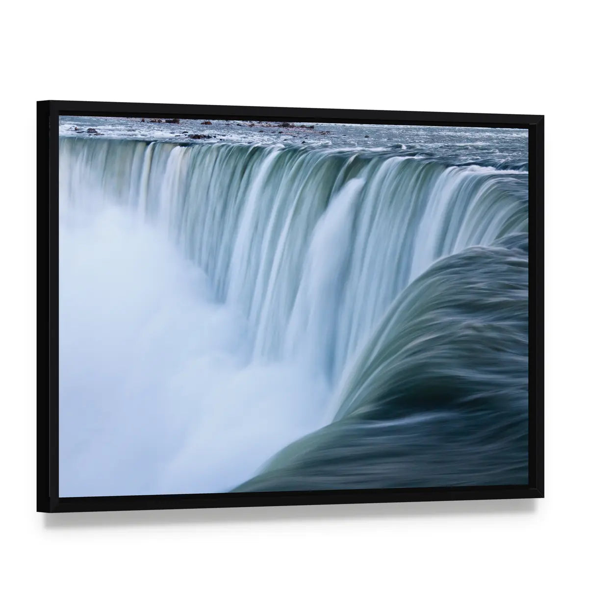 Water Over Niagara Falls Canvas Wall Art, framed canvas in a black floater frame, angled product view