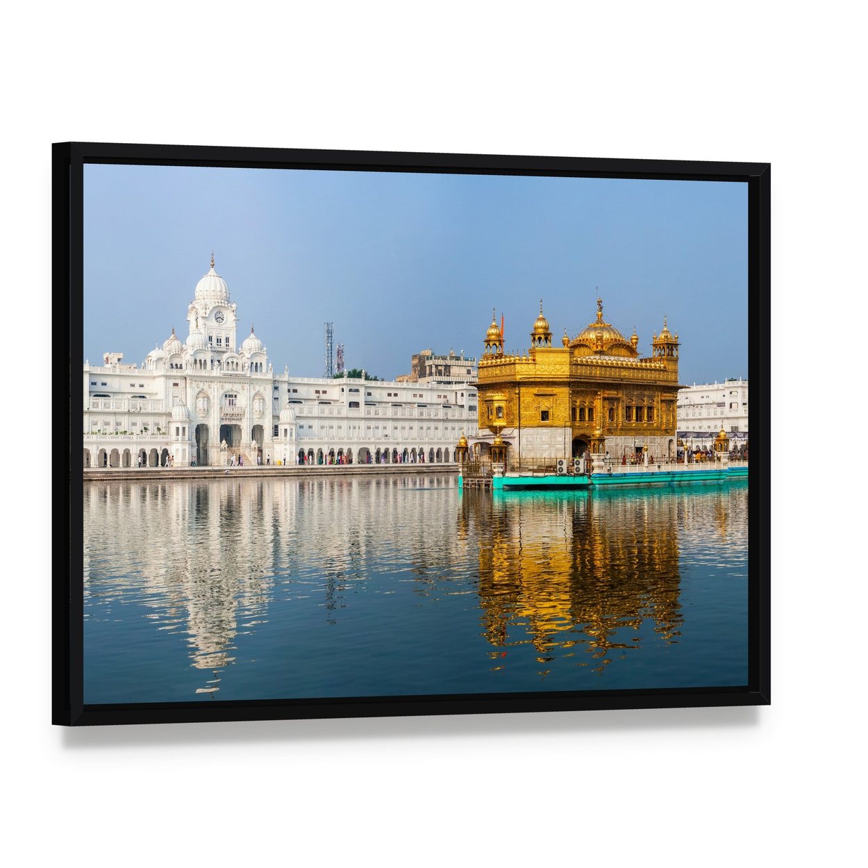 Golden Temple Reflections in India Canvas Wall Art, framed canvas in a black floater frame, angled product view