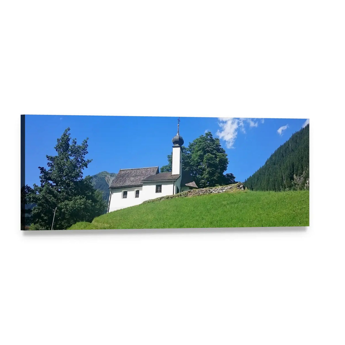 White Alpine Church on Hilltop Panoramic Canvas Wall Art, single panel gallery wrapped canvas, angled product view