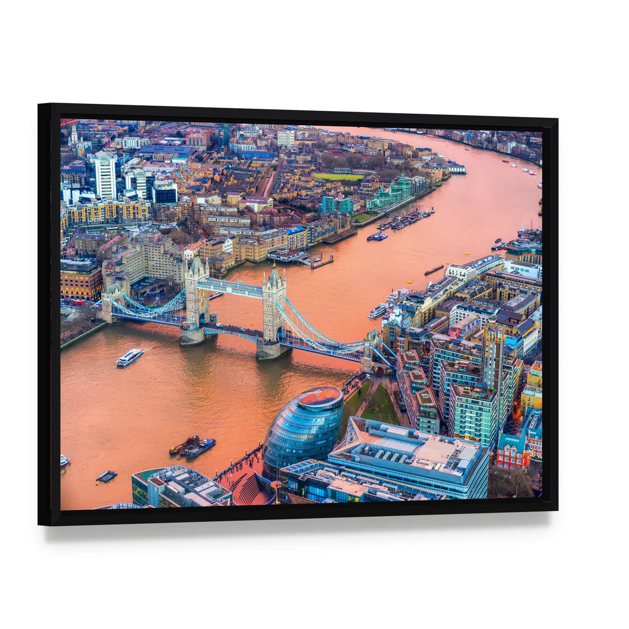 Tower Bridge And Thames River In London Canvas Wall Art, framed canvas in a black floater frame, angled product view