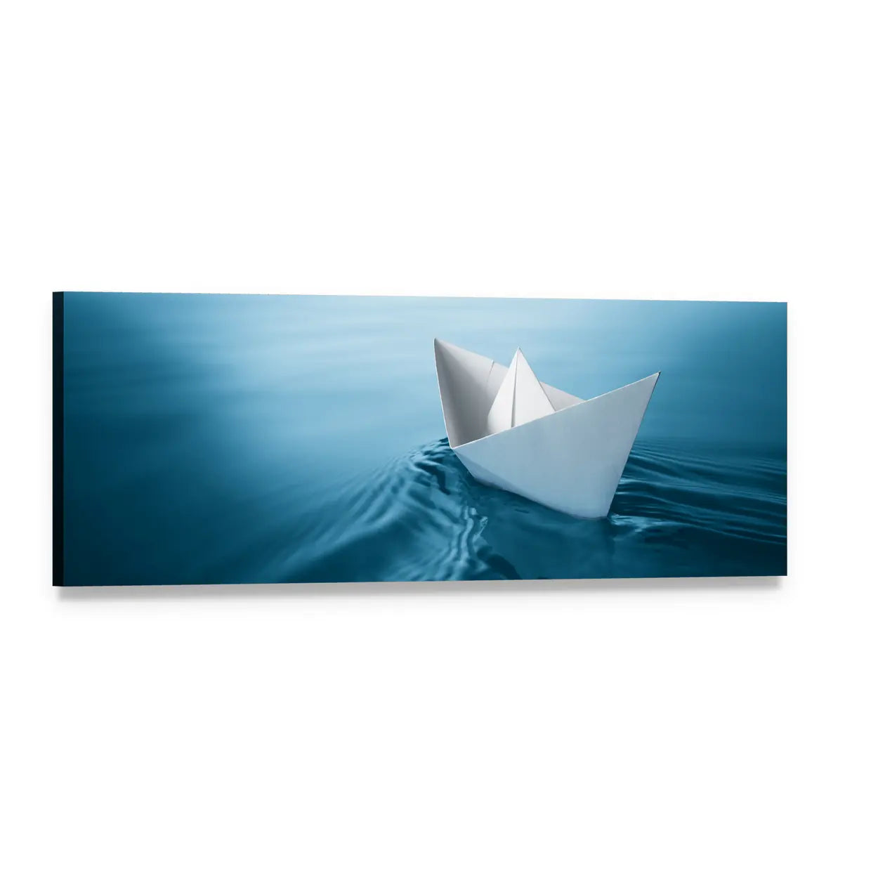 Paper Sailboat on Rippling Blue Water Panoramic Canvas Wall Art, single panel gallery wrapped canvas, angled product view