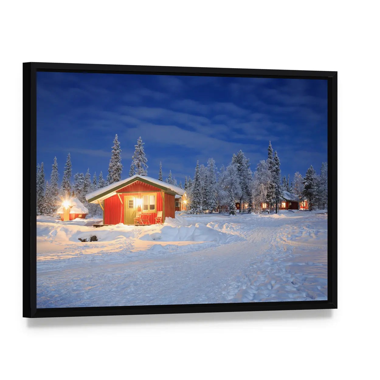Cozy Winter Cabin at Night Canvas Wall Art, framed canvas in a black floater frame, angled product view