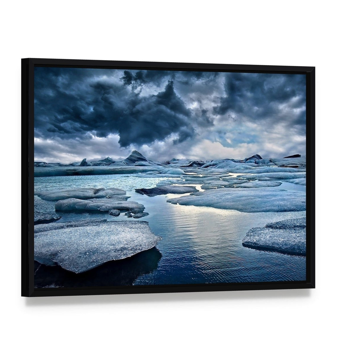 Icebergs in Jokulsarlon Glacial Lagoon Canvas Wall Art, framed canvas in a black floater frame, angled product view