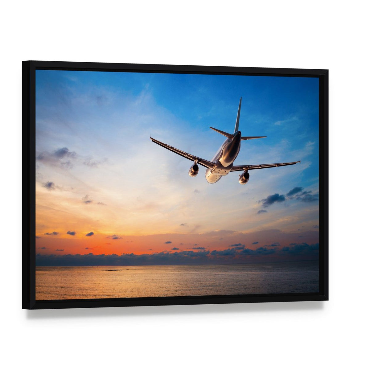 Airplane Flying Above Tropical Sea Canvas Wall Art, framed canvas in a black floater frame, angled product view