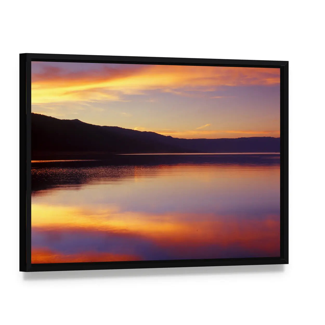 Wispy Clouds Over Lake at Sunset Canvas Wall Art, framed canvas in a black floater frame, angled product view