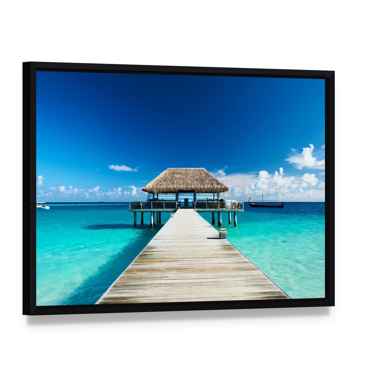 Maldives Pier and Thatched Hut on Turquoise Shore Canvas Wall Art, framed canvas in a black floater frame, angled product view