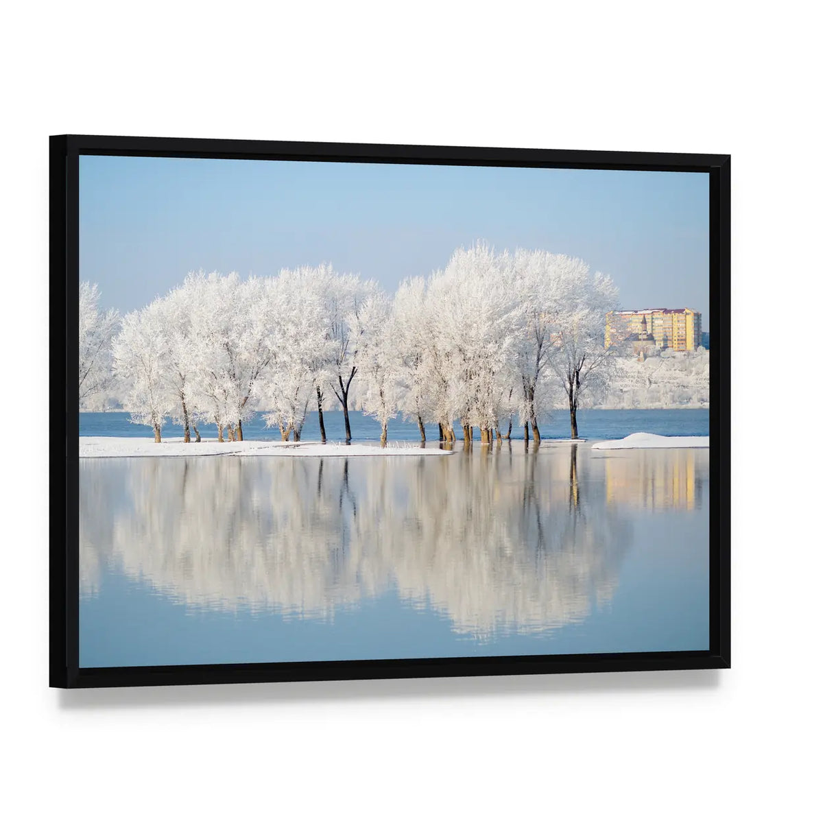 Winter Landscape by the River Canvas Wall Art, framed canvas in a black floater frame, angled product view