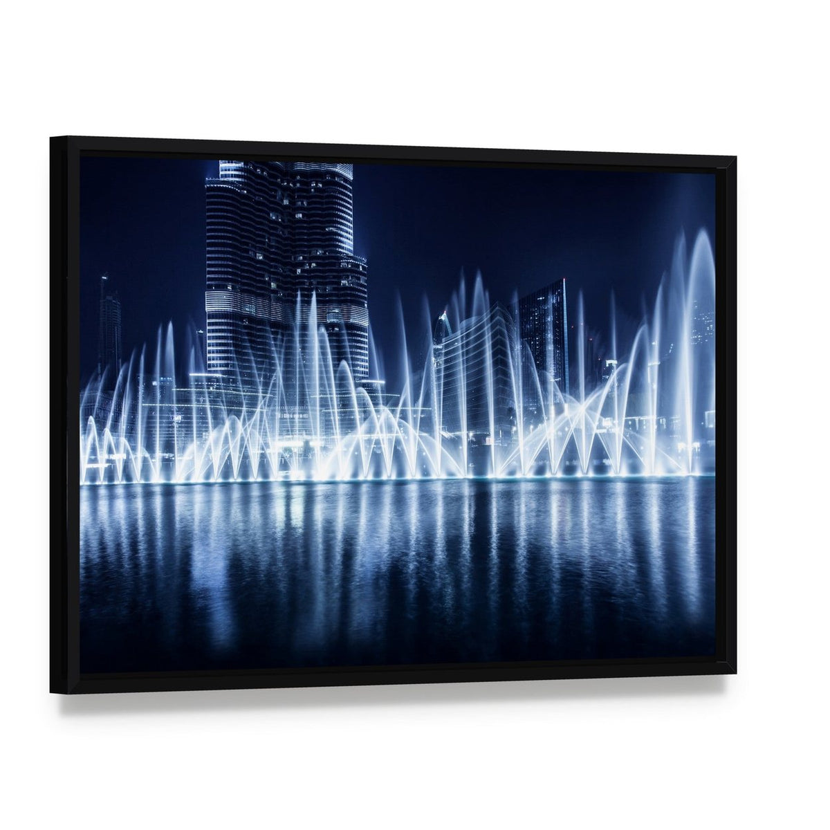Dancing Fountains Under City Lights Canvas Wall Art, framed canvas in a black floater frame, angled product view