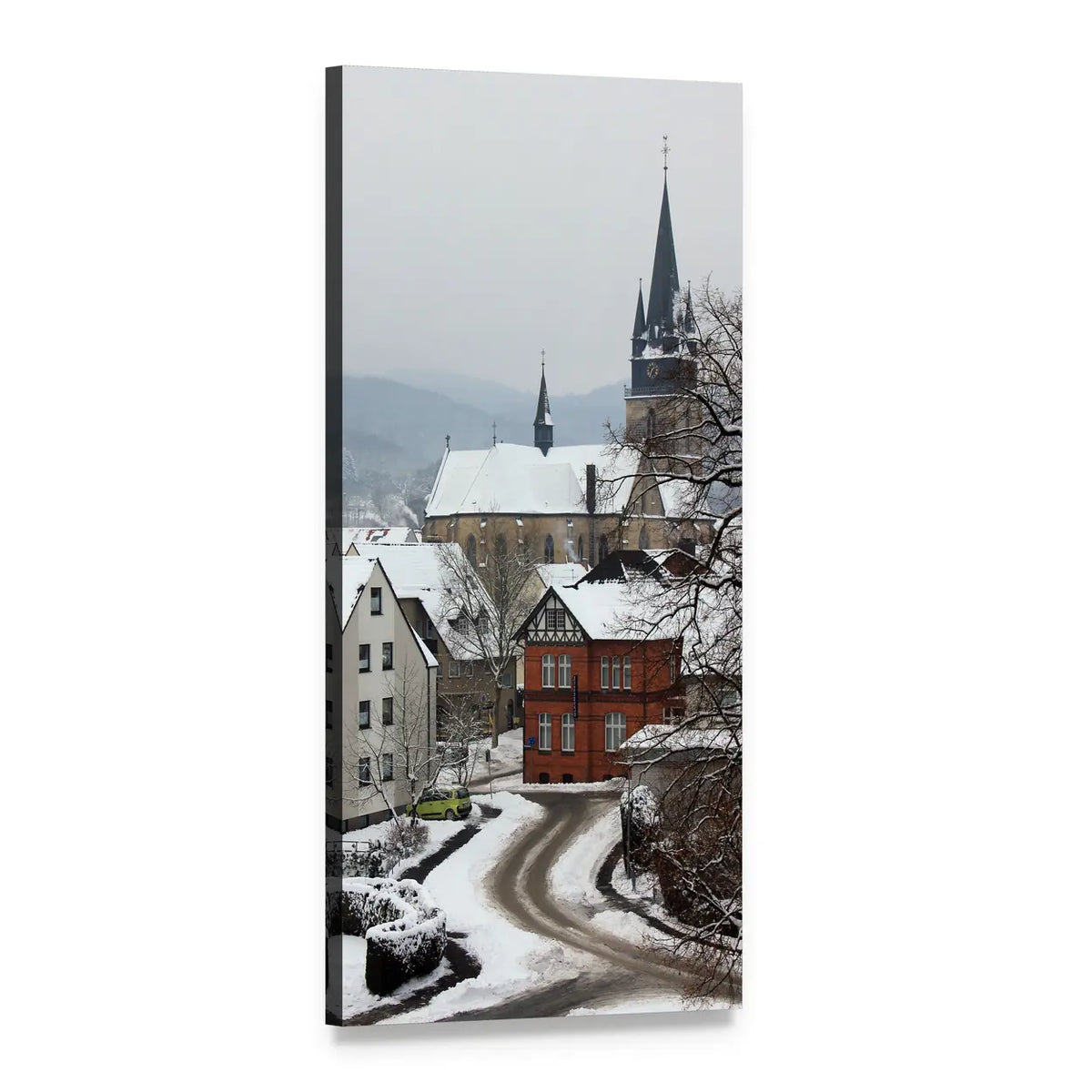 Snow-covered Village Street with Church Spire Vertical Canvas Wall Art, 1 panel 1 Vertical layout gallery wrapped canvas set, angled product view