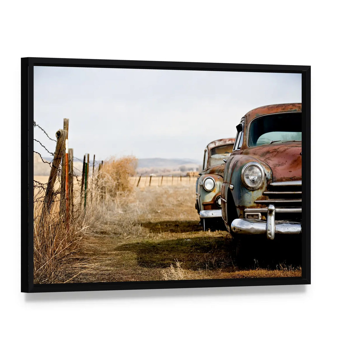 Rusty Vintage Cars in Rural Field Canvas Wall Art, framed canvas in a black floater frame, angled product view
