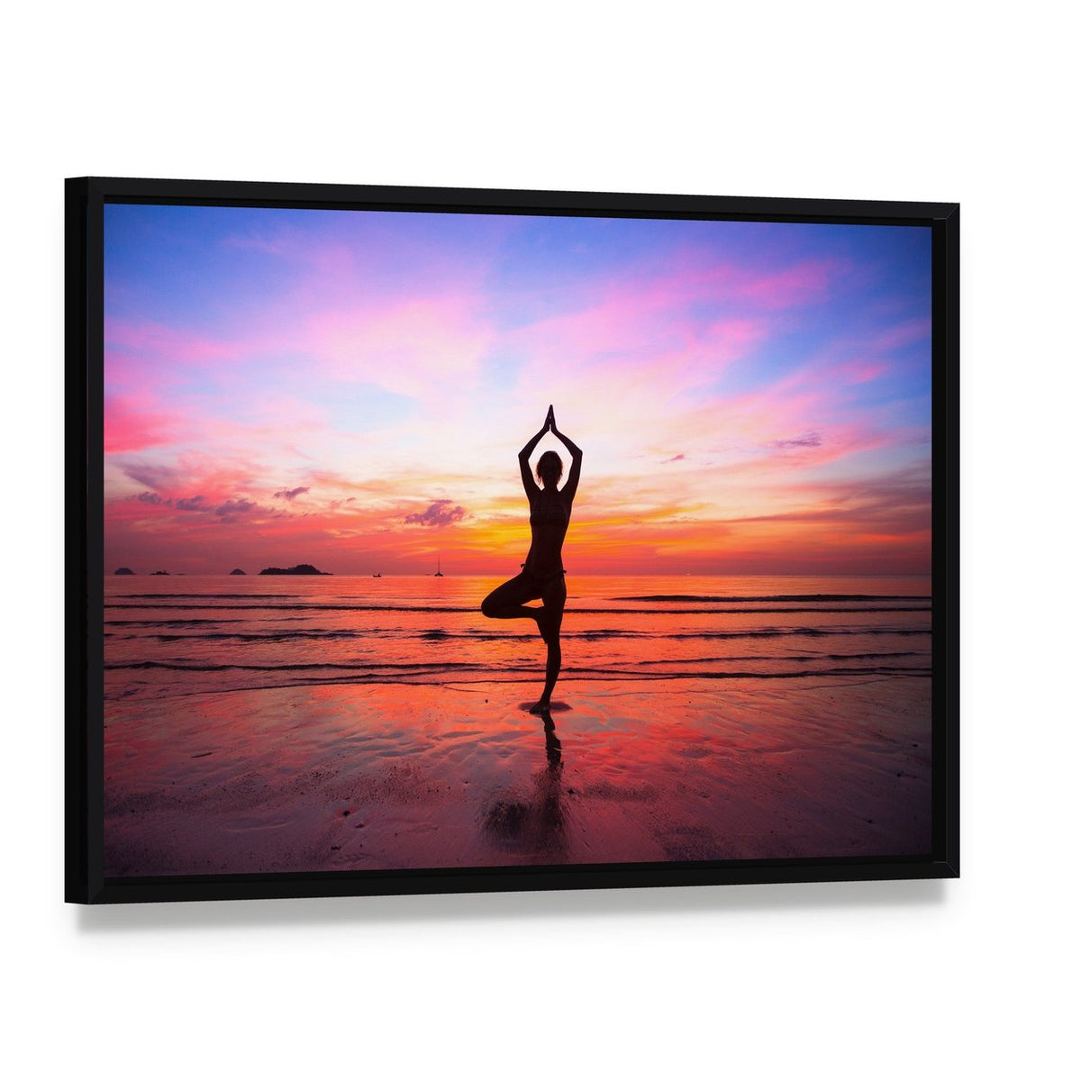 Silhouette Woman Yoga at the Seaside Sunset Canvas Wall Art, framed canvas in a black floater frame, angled product view