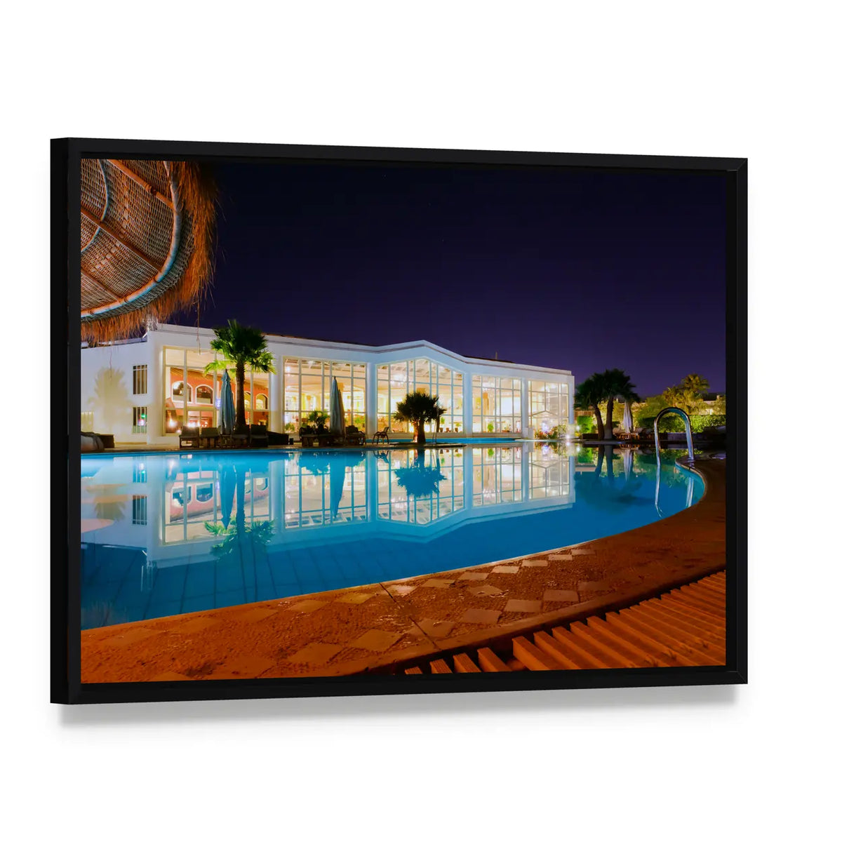 Luxury Resort Pool at Night Canvas Wall Art, framed canvas in a black floater frame, angled product view
