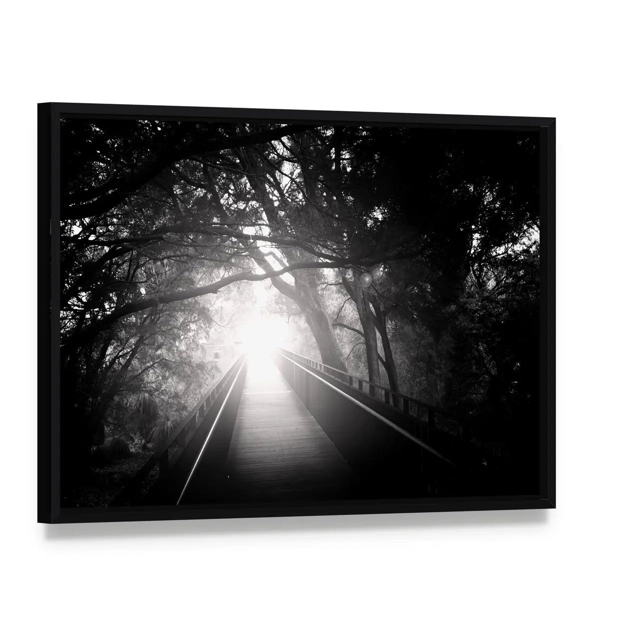 Wooden Bridge Into Sunlit Forest Canvas Wall Art, framed canvas in a black floater frame, angled product view