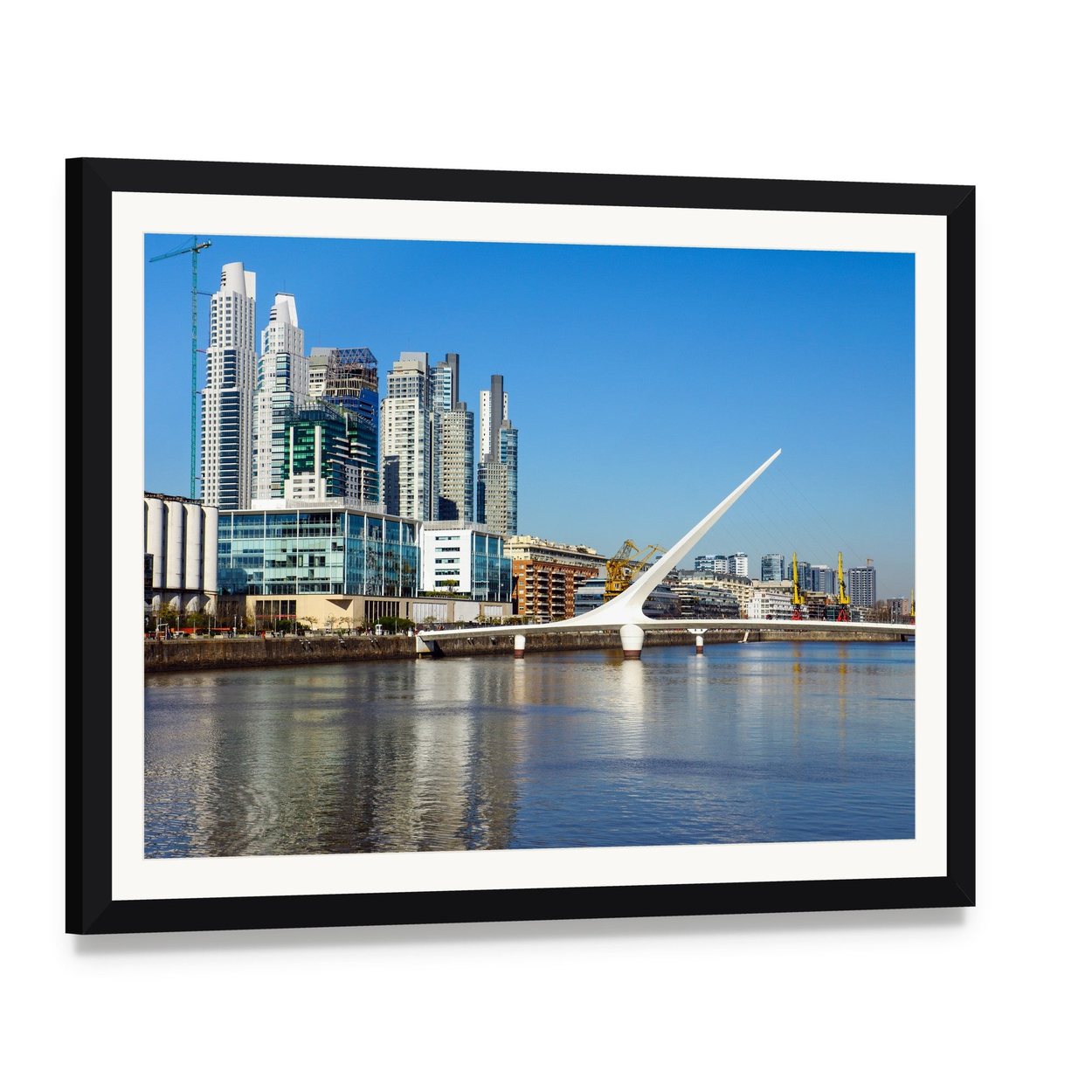 Puerto Madero Cityscape with Suspension Bridge Canvas Wall Art, framed print with white mat and black frame, angled product view