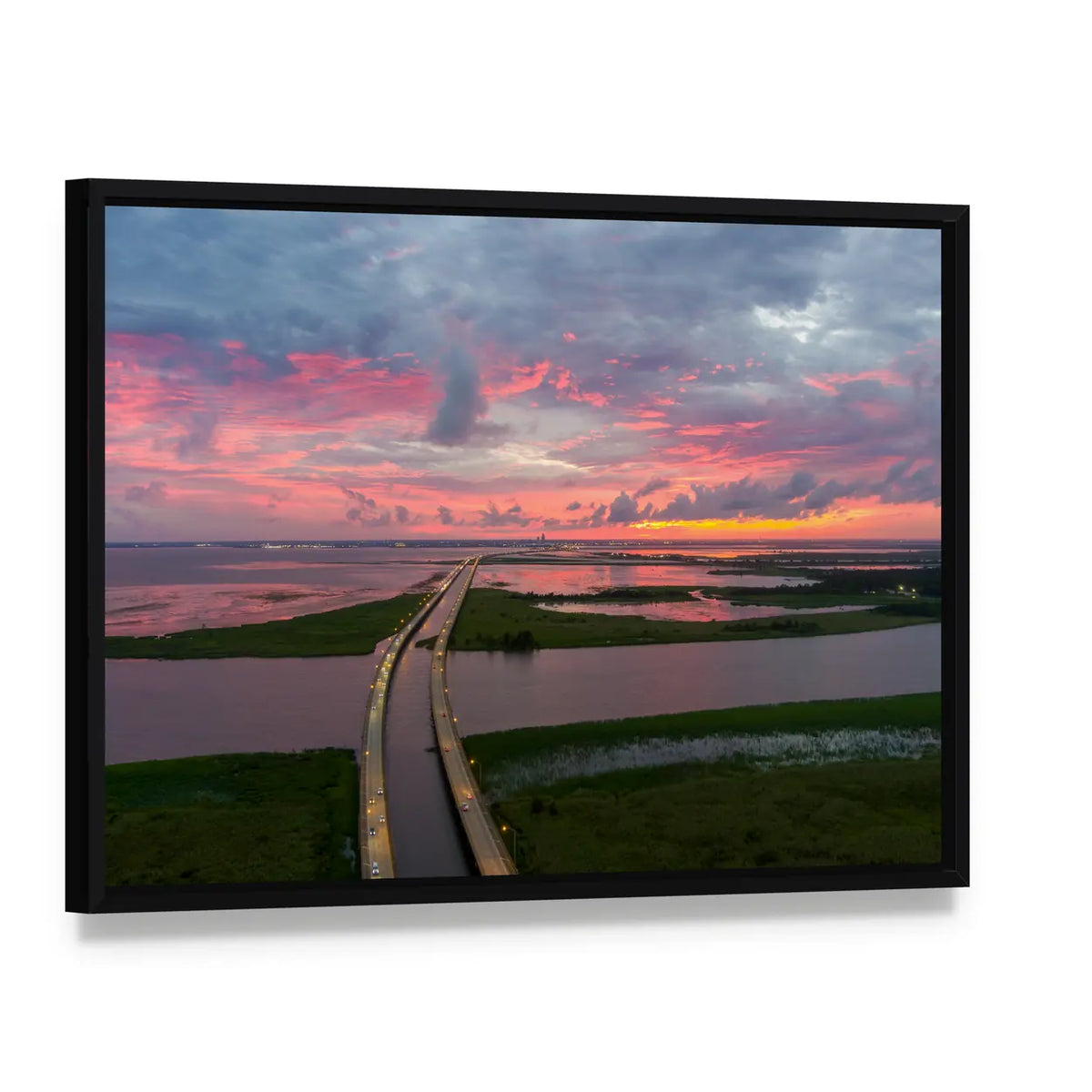 Sunset Over Coastal Bridge Canvas Wall Art, framed canvas in a black floater frame, angled product view