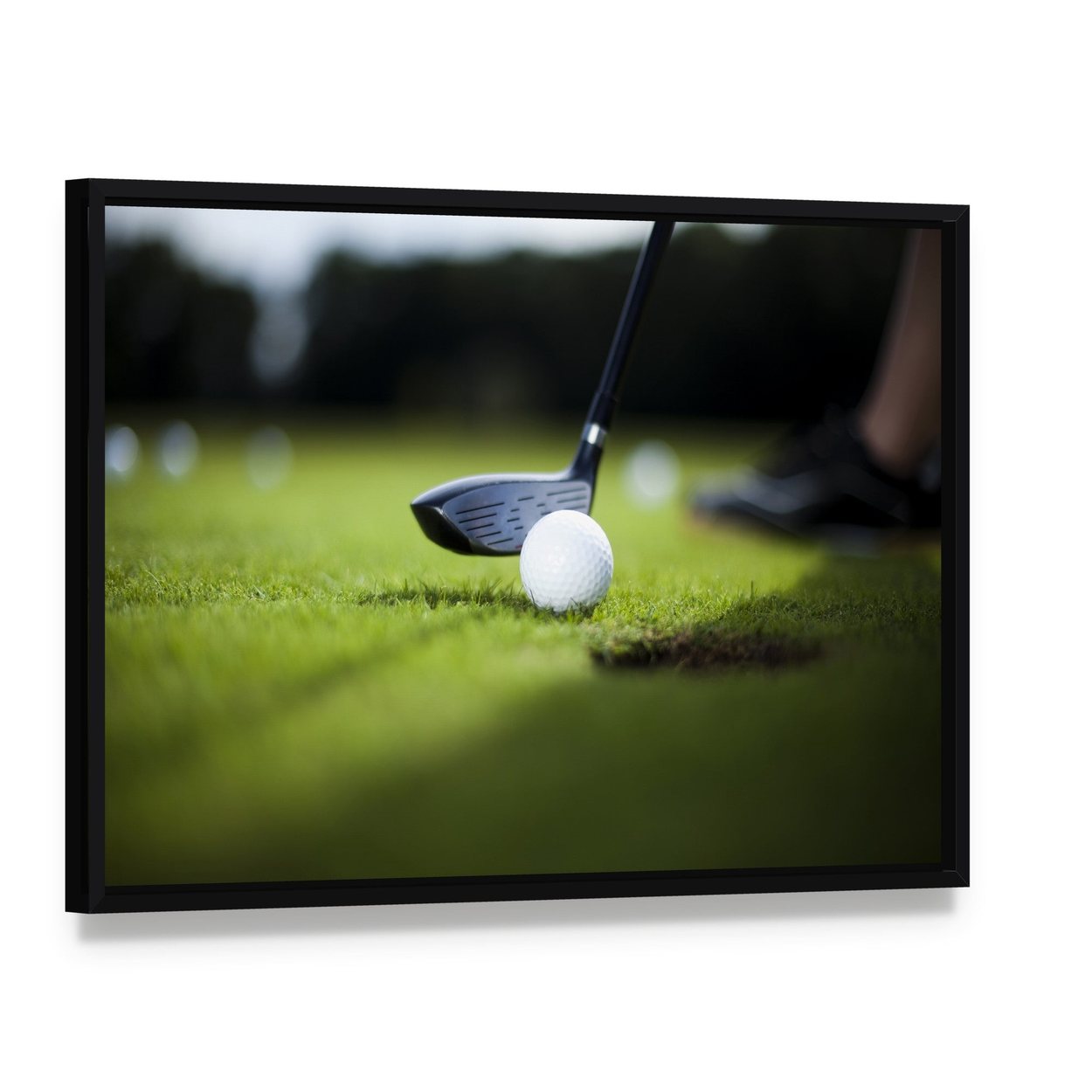 Golf Ball on Green Meadow Canvas Wall Art, framed canvas in a black floater frame, angled product view