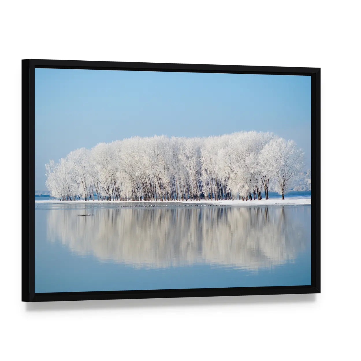 Clear Blue Winter Landscape Canvas Wall Art, framed canvas in a black floater frame, angled product view