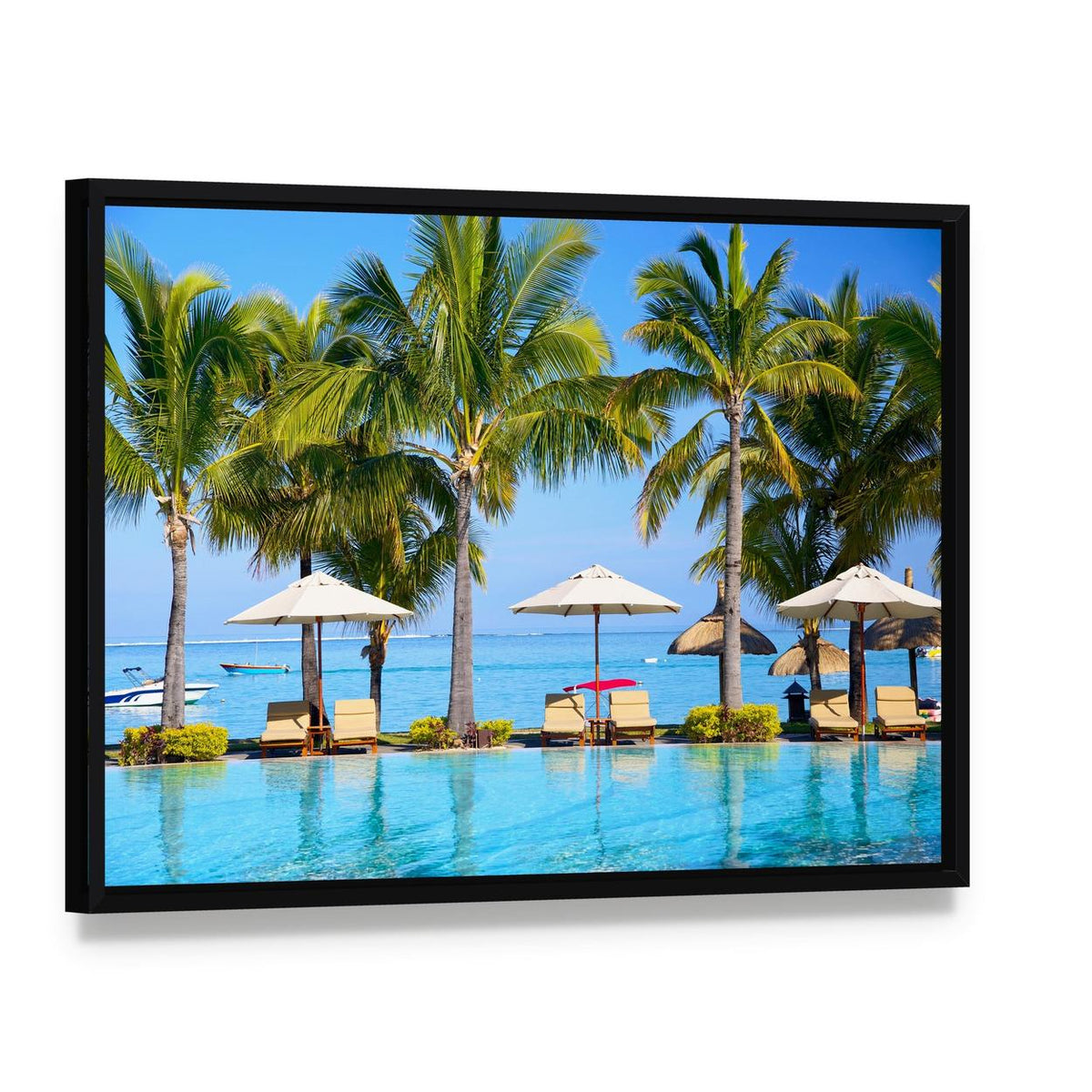 Swimming Pool with Lounge Chairs and Palm Trees Canvas Wall Art, framed canvas in a black floater frame, angled product view