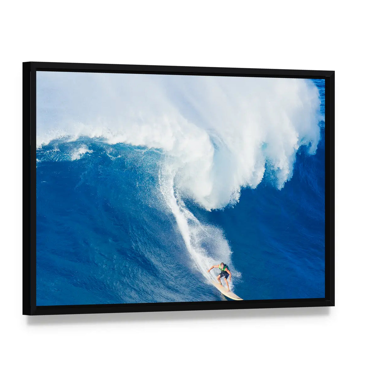 Extreme Surfer Riding Canvas Wall Art, framed canvas in a black floater frame, angled product view