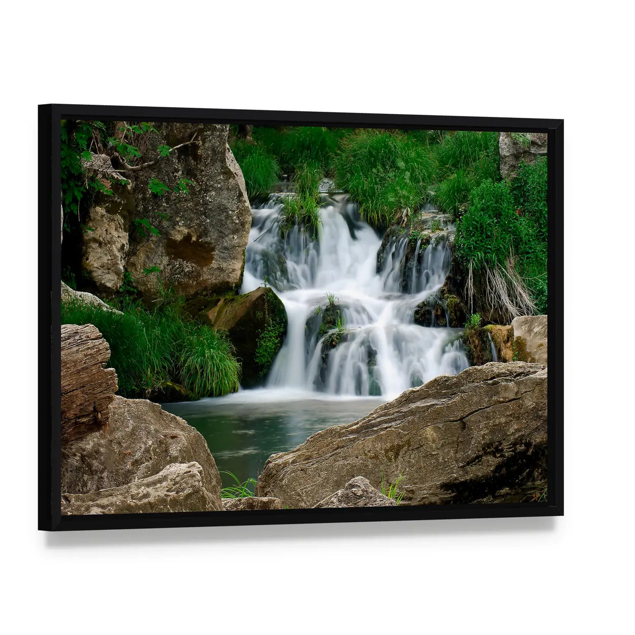 Small Forest Waterfall Canvas Wall Art, framed canvas in a black floater frame, angled product view