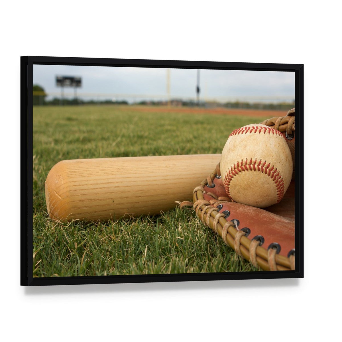 Baseball & Bat on Field Canvas Wall Art, framed canvas in a black floater frame, angled product view
