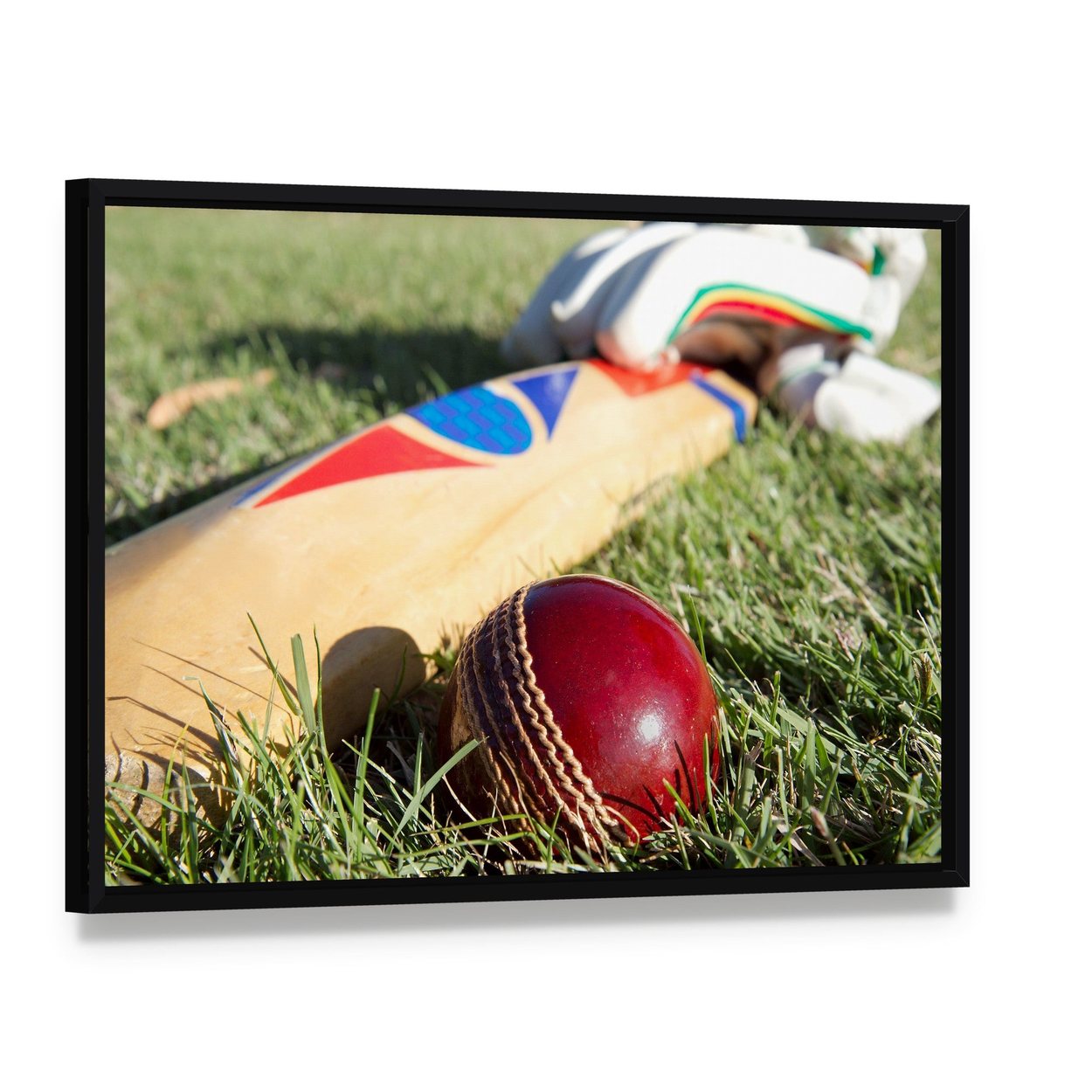 Cricket Ball Bat & Gloves Canvas Wall Art, framed canvas in a black floater frame, angled product view
