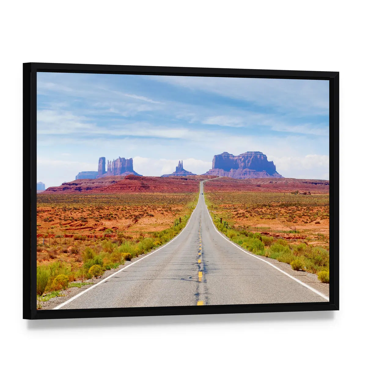 U.s. Route 163 Through Monument Valley Canvas Wall Art, framed canvas in a black floater frame, angled product view