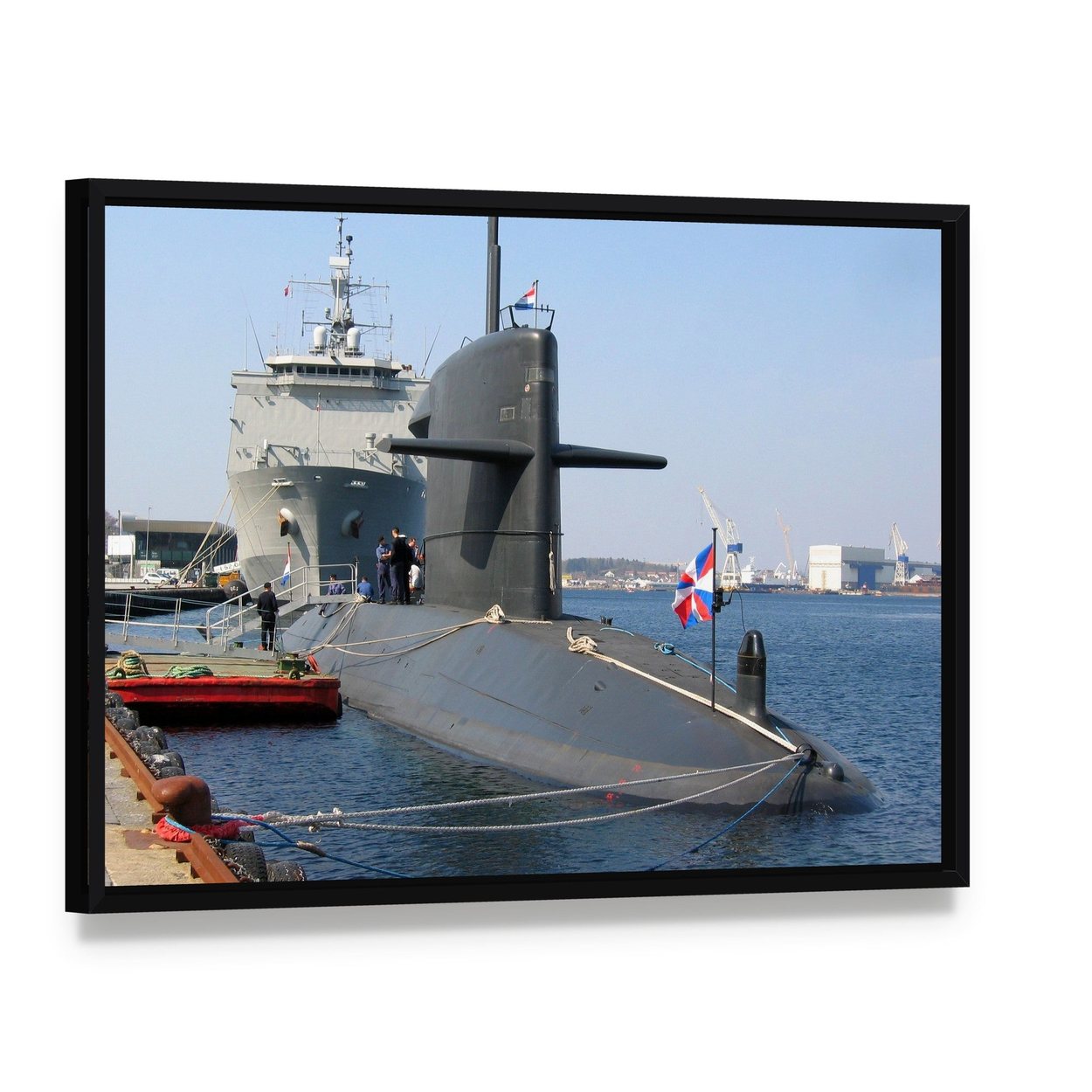 Docked Submarine Canvas Wall Art, framed canvas in a black floater frame, angled product view