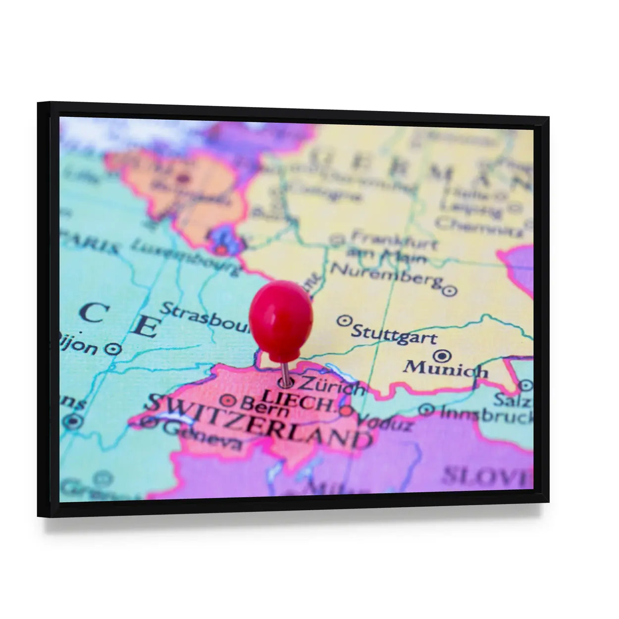 Red Pushpin on Map of Switzerland Canvas Wall Art, framed canvas in a black floater frame, angled product view