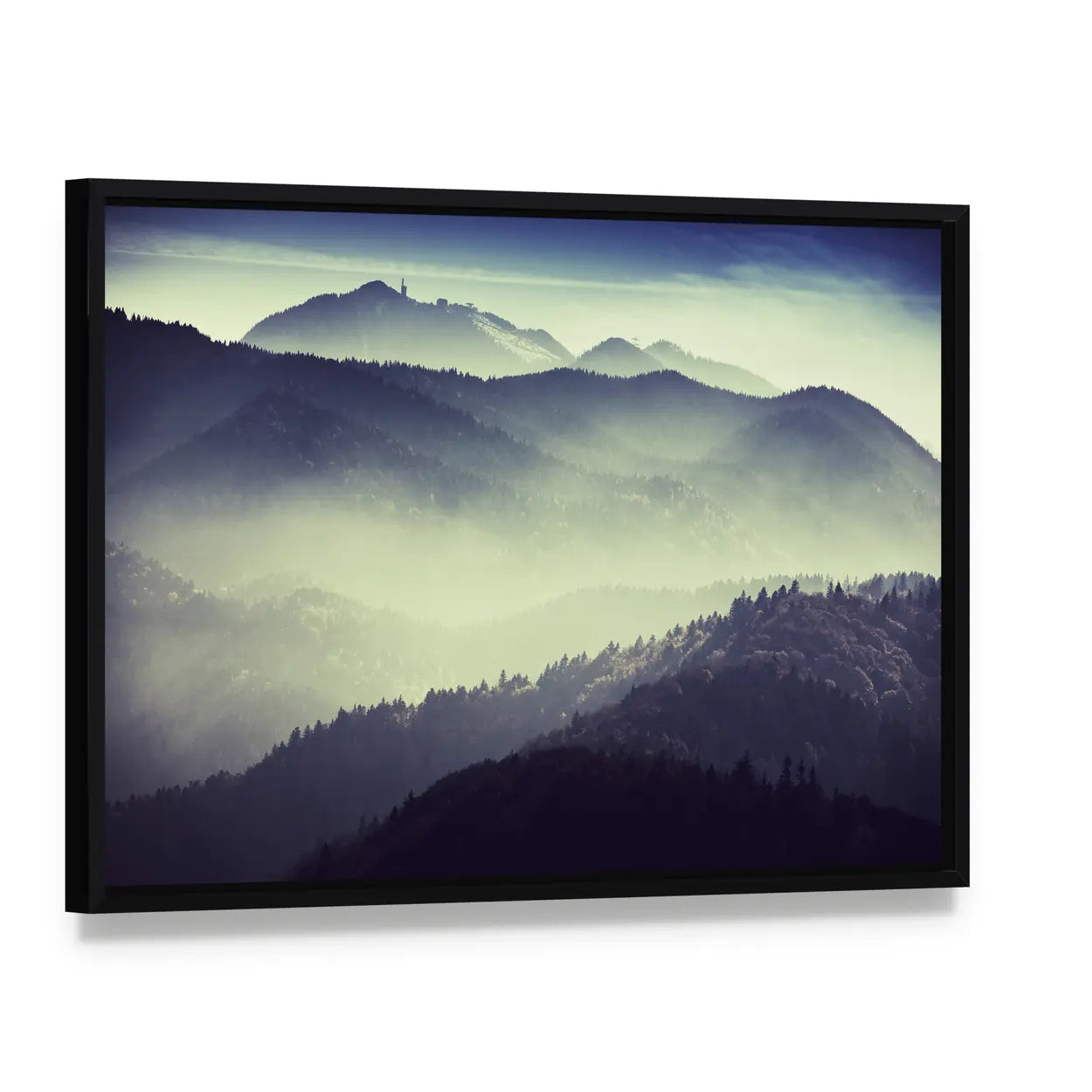 Misty Mountain Valley with Tower Silhouette Canvas Wall Art, framed canvas in a black floater frame, angled product view