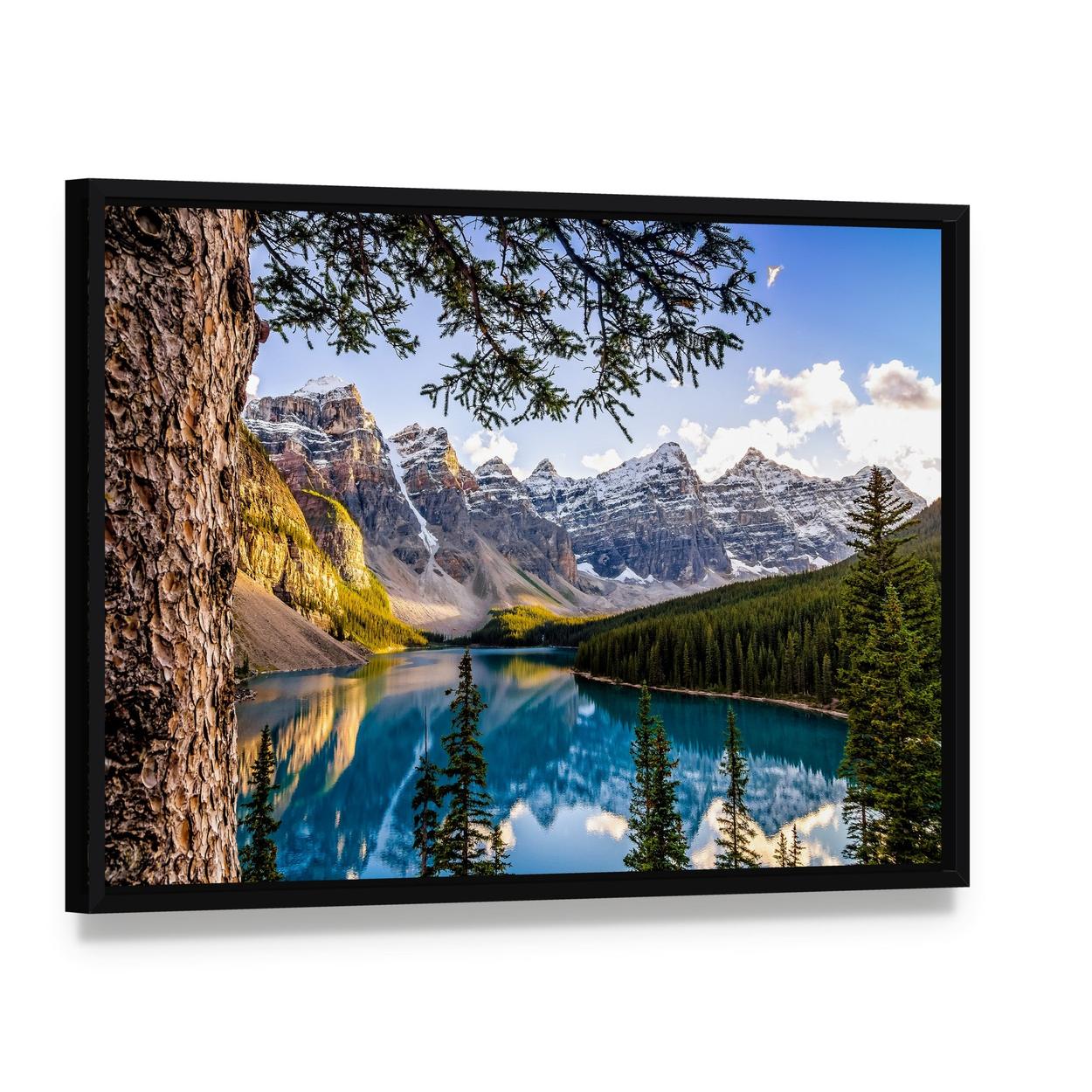 Moraine Lake Reflection with Snow-capped Mountains Canvas Wall Art, framed canvas in a black floater frame, angled product view