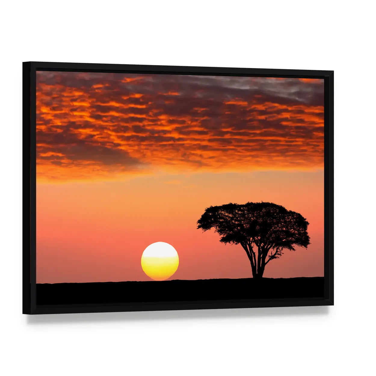 Sunset In The Serengeti Park In Tanzania Canvas Wall Art, framed canvas in a black floater frame, angled product view