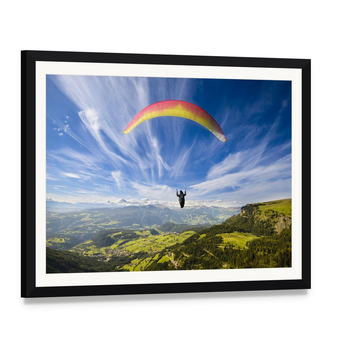 Paraglider Flying Over Mountains Canvas Wall Art, framed print with white mat and black frame, angled product view