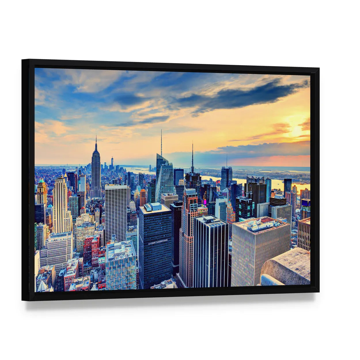 New York City Skyline at Dusk Canvas Wall Art, framed canvas in a black floater frame, angled product view