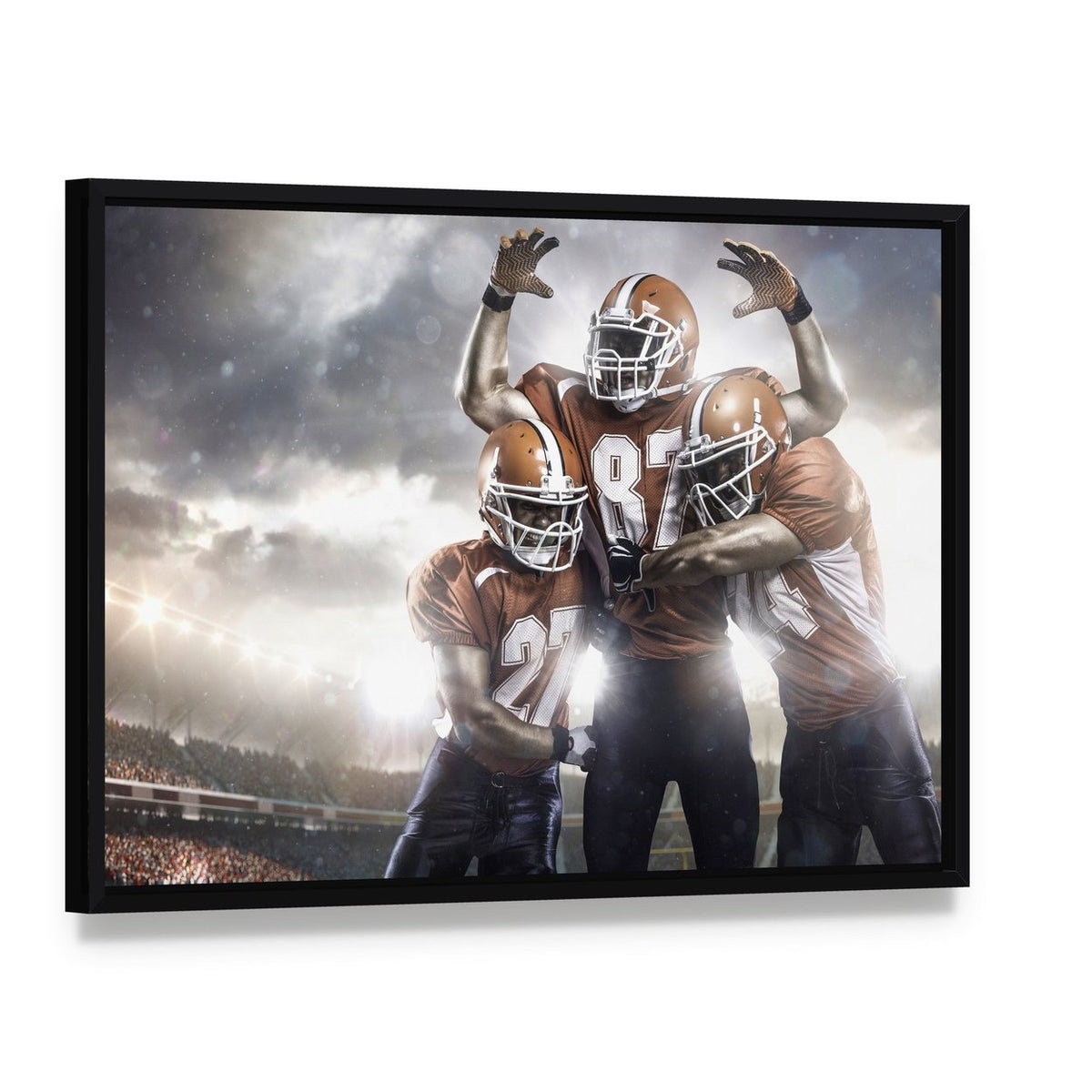 Three American Football Players Canvas Wall Art, framed canvas in a black floater frame, angled product view