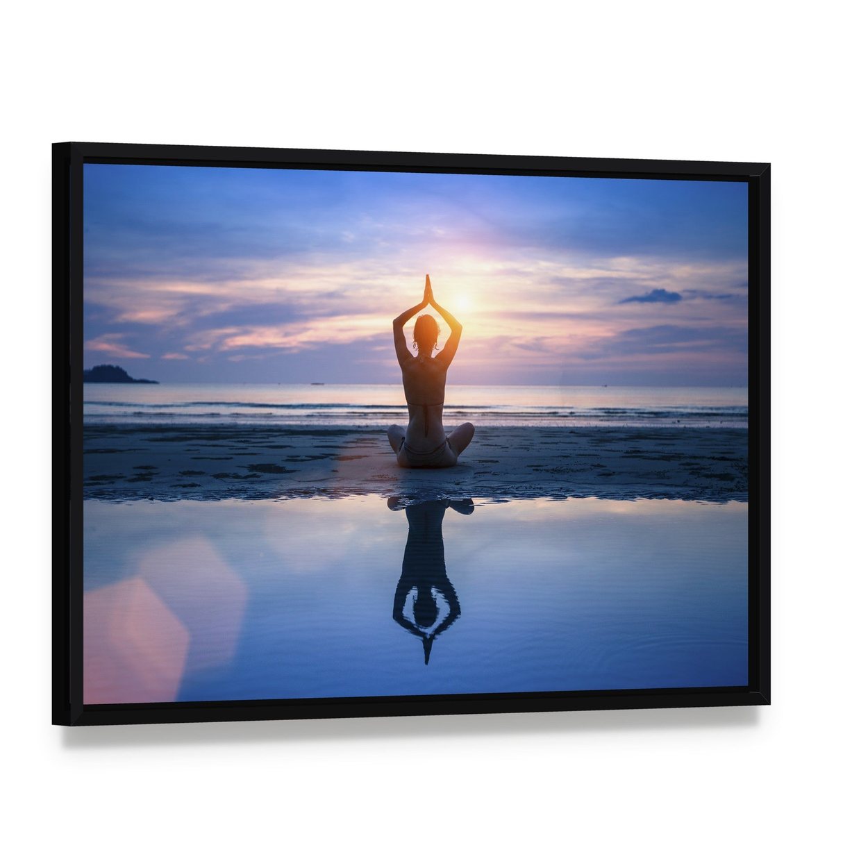 Yoga on the Sea Beach Meditation Canvas Wall Art, framed canvas in a black floater frame, angled product view