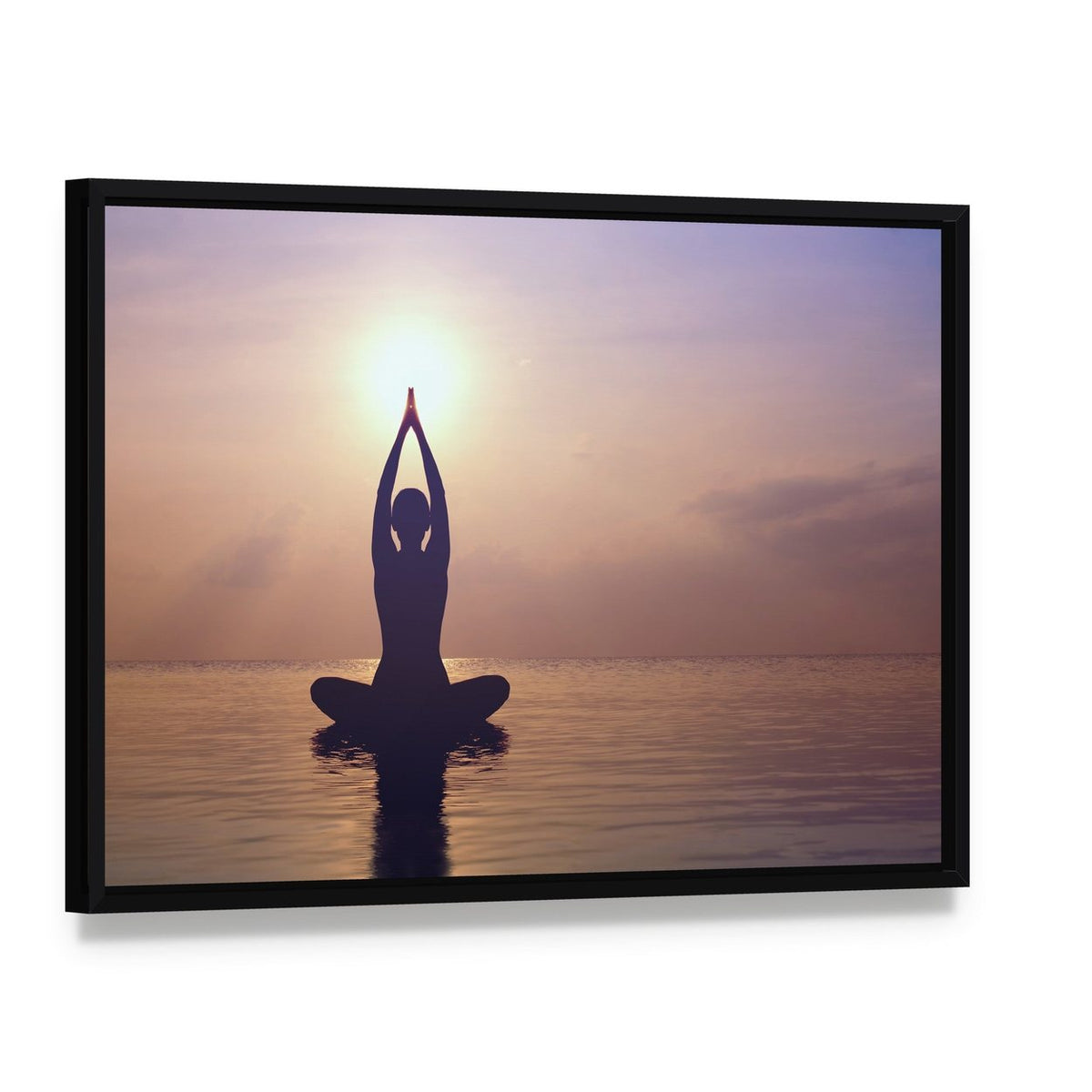 Silhouette Young Woman Practicing Yoga on the Beach at Sunset Canvas Wall Art, framed canvas in a black floater frame, angled product view