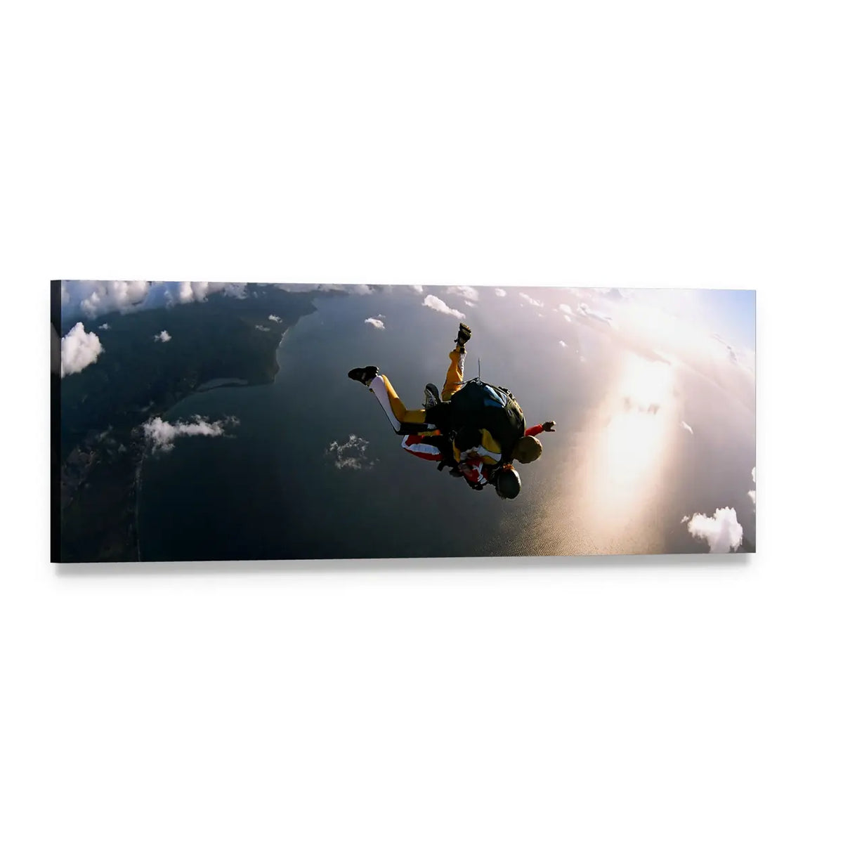 Tandem Skydivers Over Sunlit Coastline Panoramic Canvas Wall Art, single panel gallery wrapped canvas, angled product view
