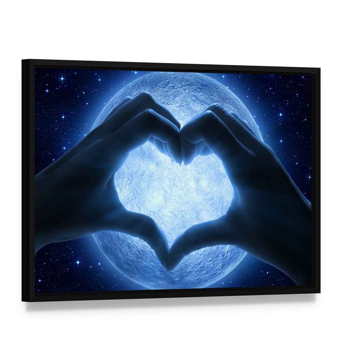 Hands Heart Moon Canvas Wall Art, framed canvas in a black floater frame, angled product view