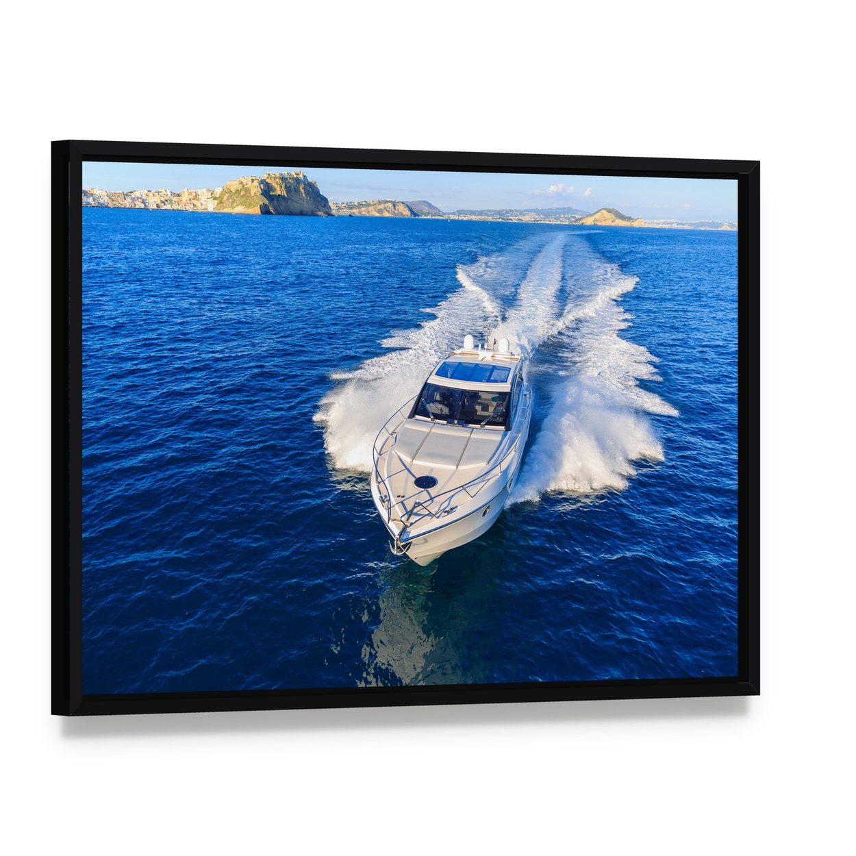 White Yacht in Ocean Canvas Wall Art, framed canvas in a black floater frame, angled product view