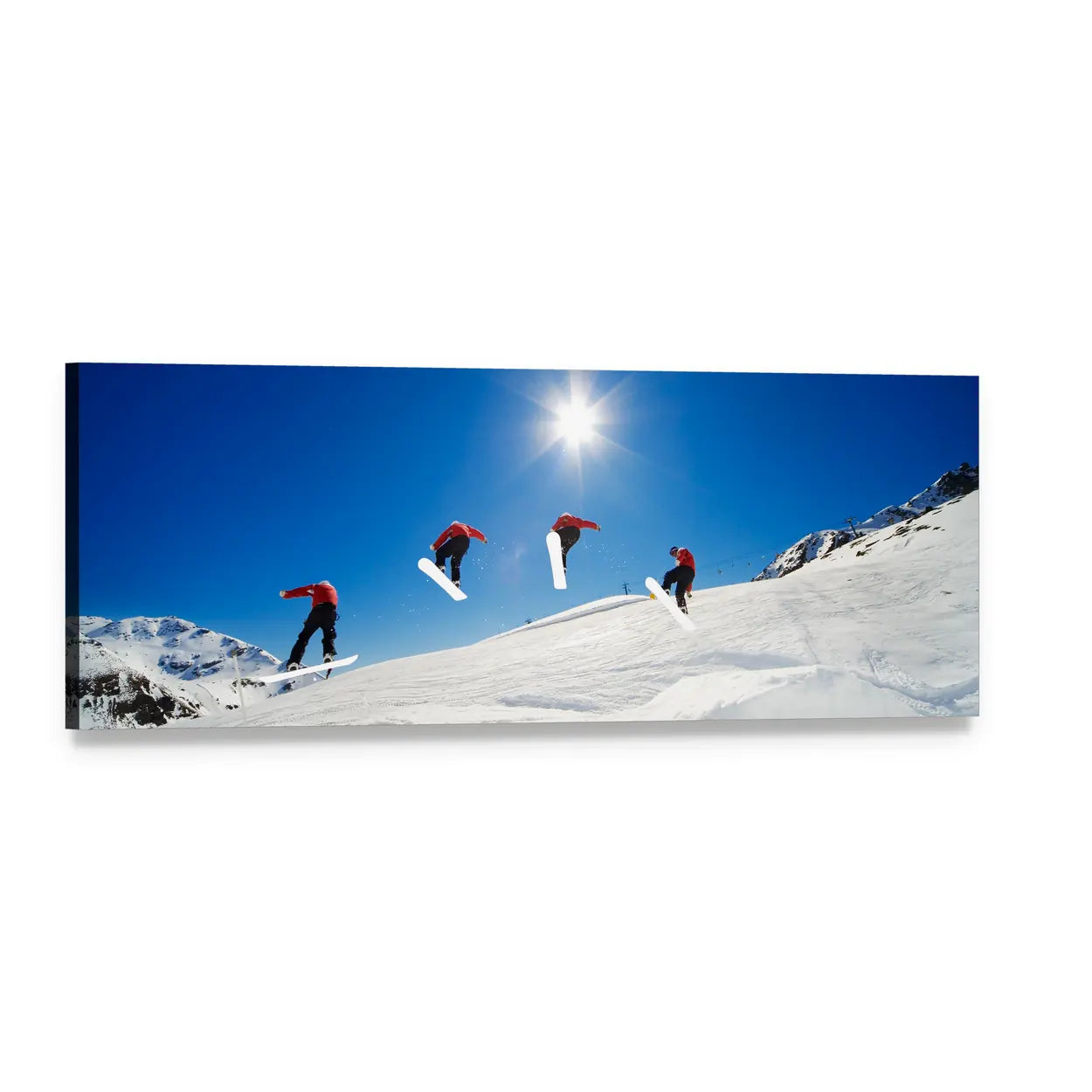 Four Snowboarders Mid-air Over Snow Slopes Panoramic Canvas Wall Art, single panel gallery wrapped canvas, angled product view