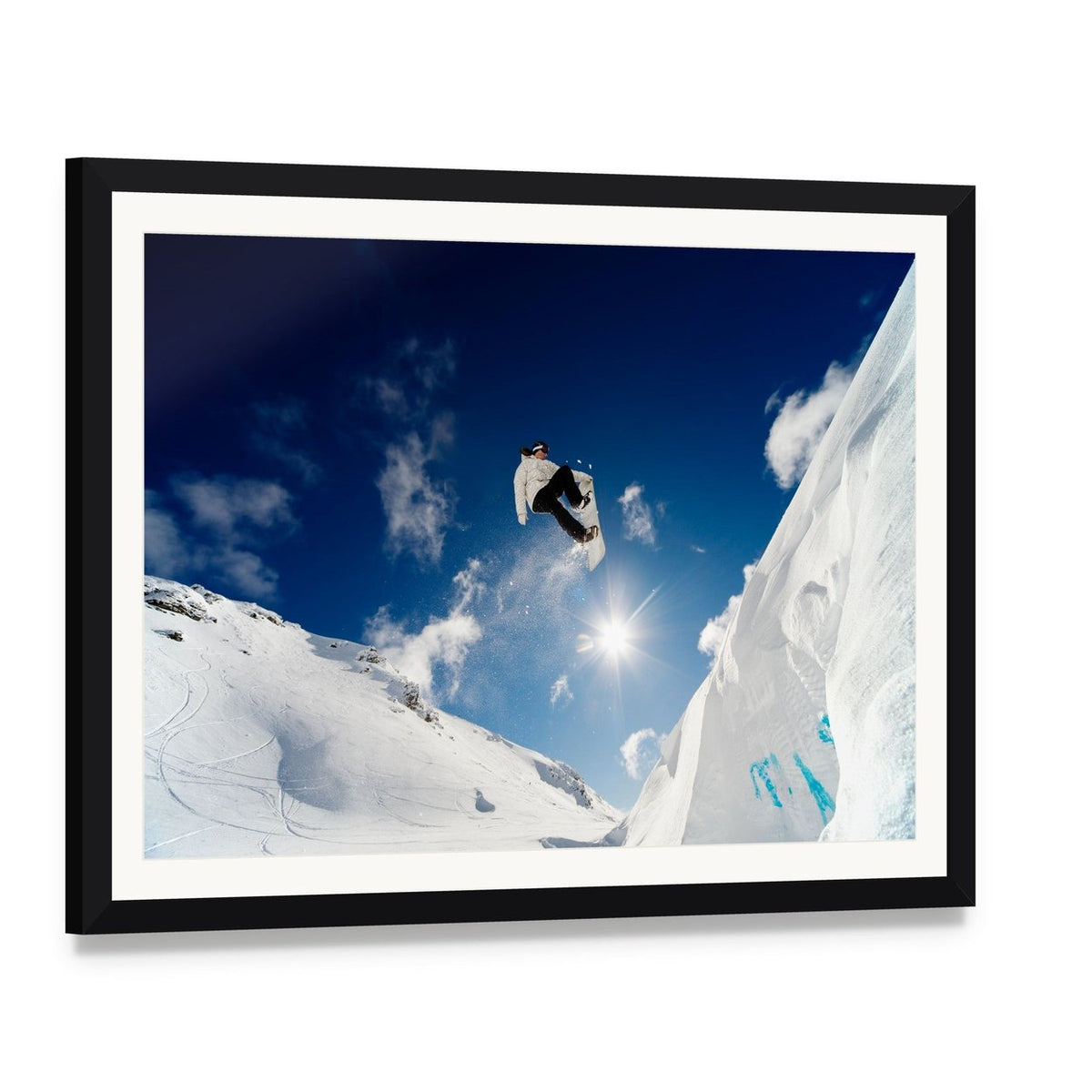 Snowboarder Jumping Through the Air Canvas Wall Art, framed print with white mat and black frame, angled product view