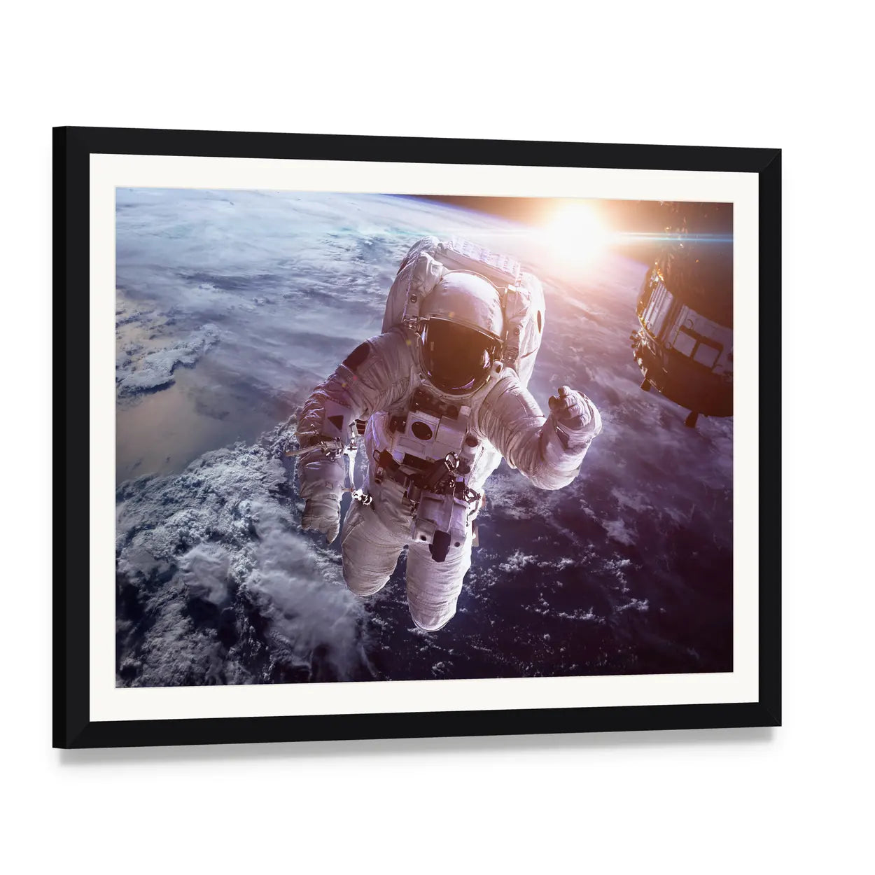 Astronaut Above the Earth Canvas Wall Art, framed print with white mat and black frame, angled product view