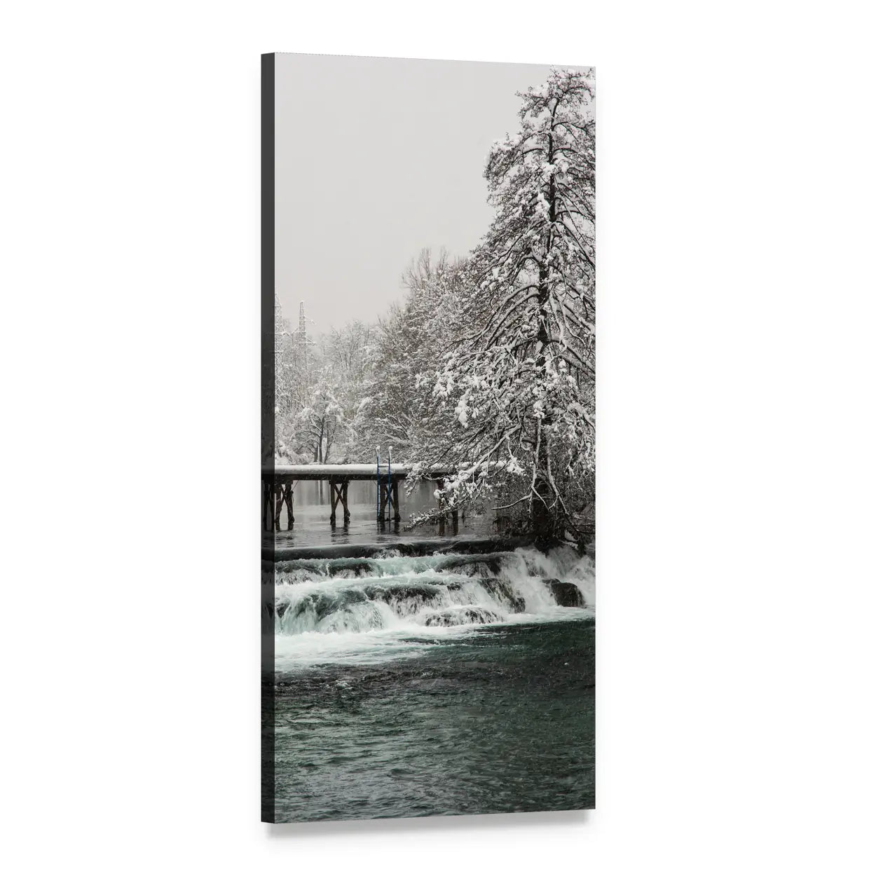 Snowy Footbridge Over Dark Teal River Vertical Canvas Wall Art, 1 panel 1 Vertical layout gallery wrapped canvas set, angled product view