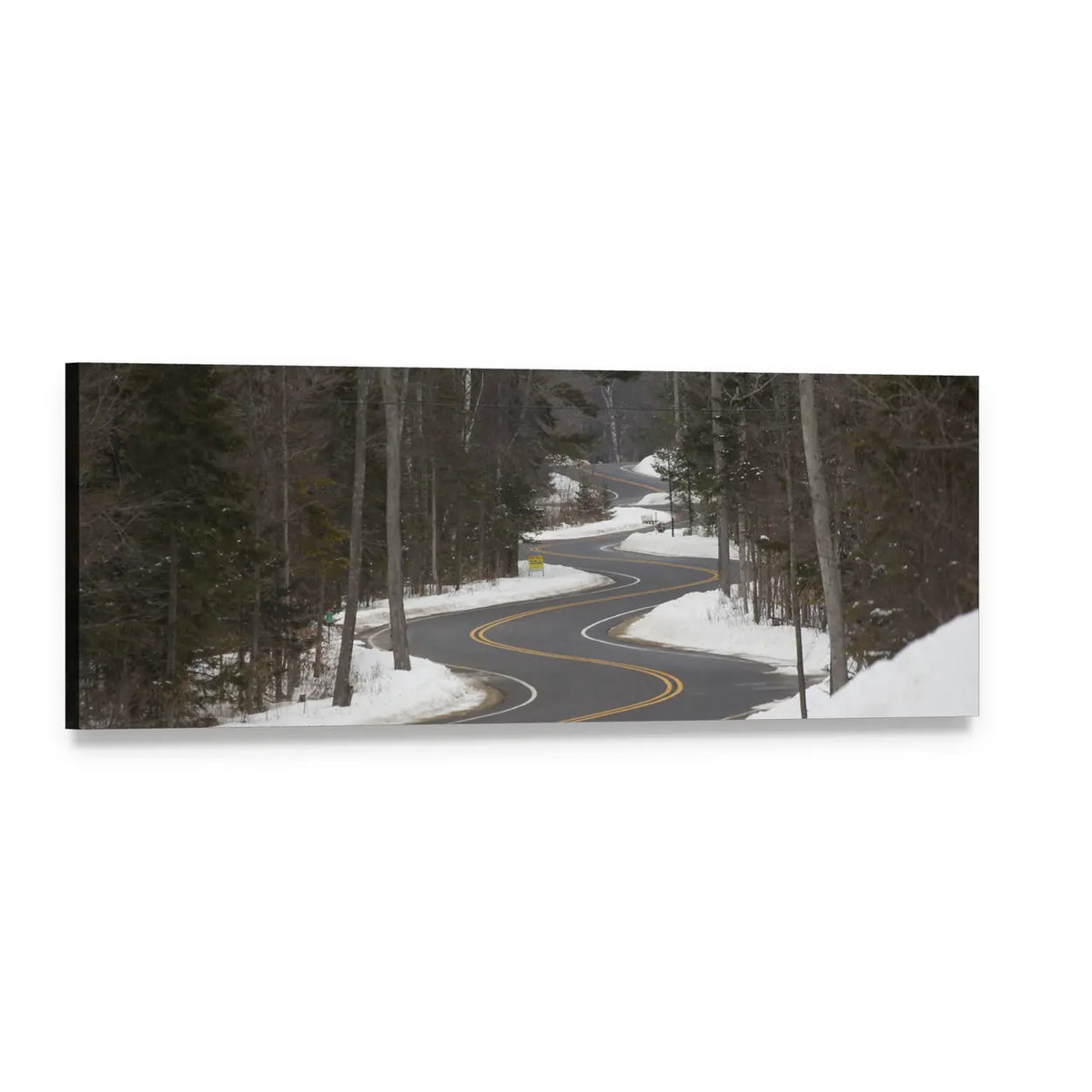 Winding Winter Road Through Snowy Forest Panoramic Canvas Wall Art, single panel gallery wrapped canvas, angled product view