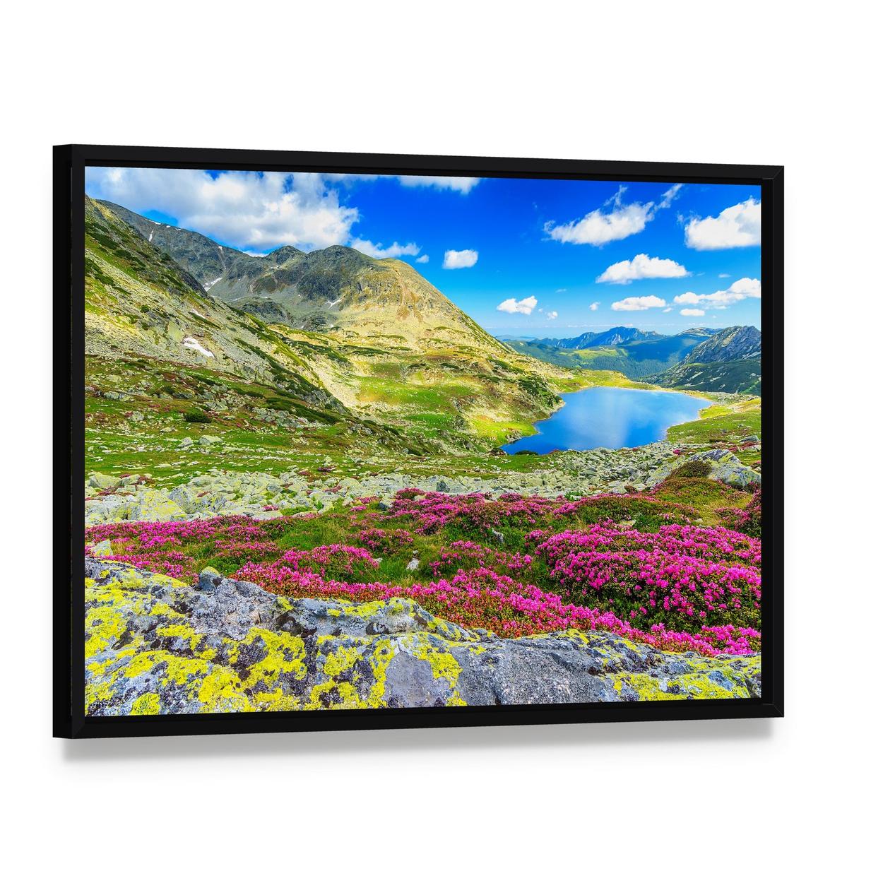 Glacier Lake with Wildflowers Canvas Wall Art, framed canvas in a black floater frame, angled product view
