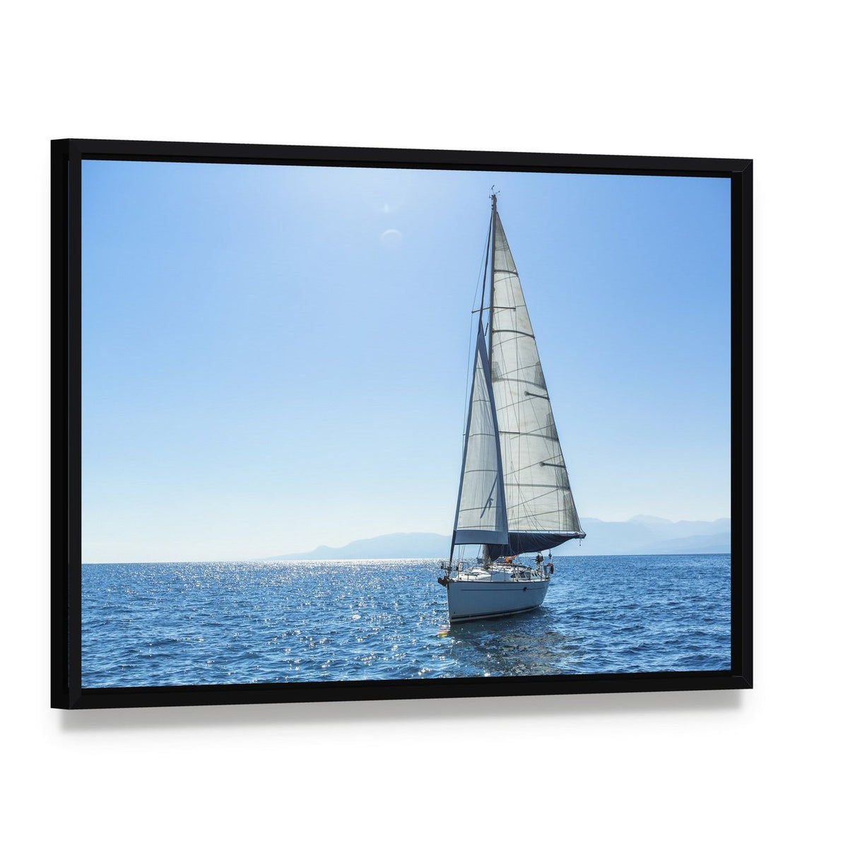 Sailing Ship Yachts with White Sails in the Open Sea Canvas Wall Art, framed canvas in a black floater frame, angled product view