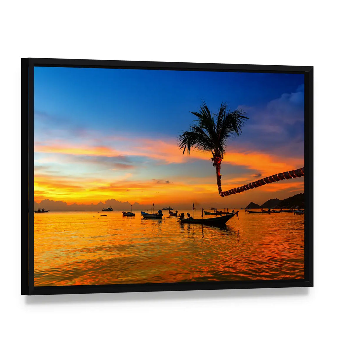 Sunset Beach with Leaning Palm and Boats Canvas Wall Art, framed canvas in a black floater frame, angled product view