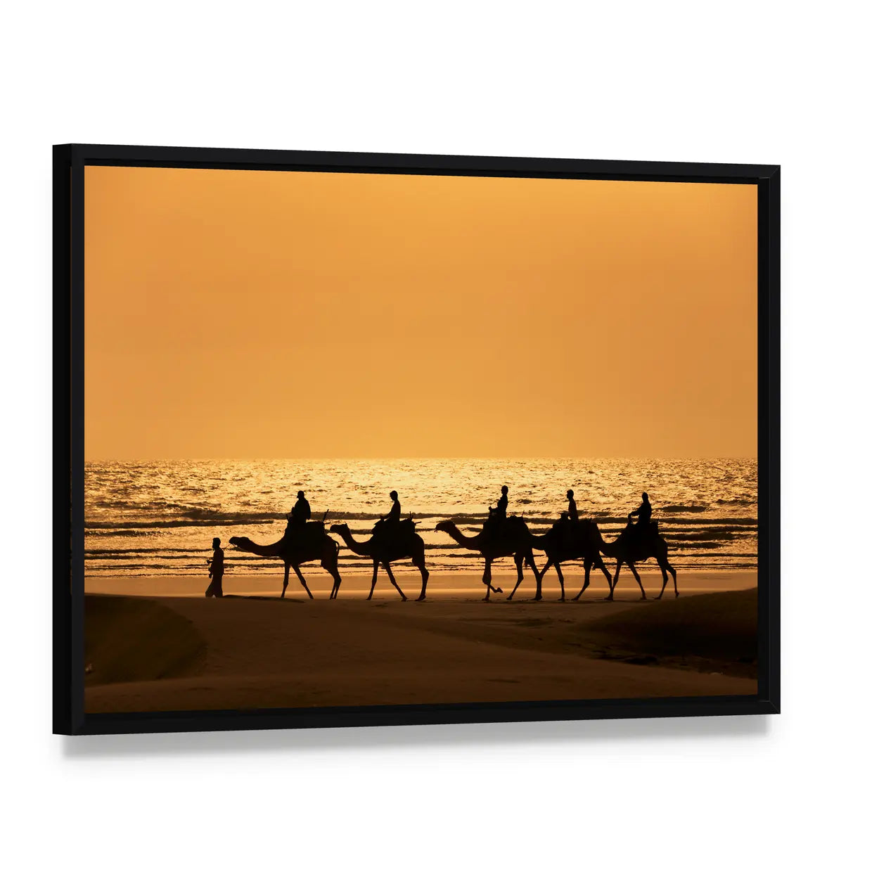 Sunset Camel Caravan Silhouette Canvas Wall Art, framed canvas in a black floater frame, angled product view